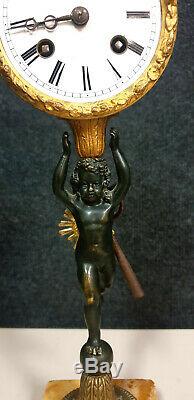 Superbe pendule au Putto époque XIXeme en bronze doré et patiné