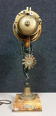 Superbe pendule au Putto époque XIXeme en bronze doré et patiné