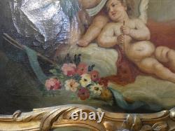 Trumeau aux anges de style Louis XV en bois laqué et doré, époque fin XIX ème